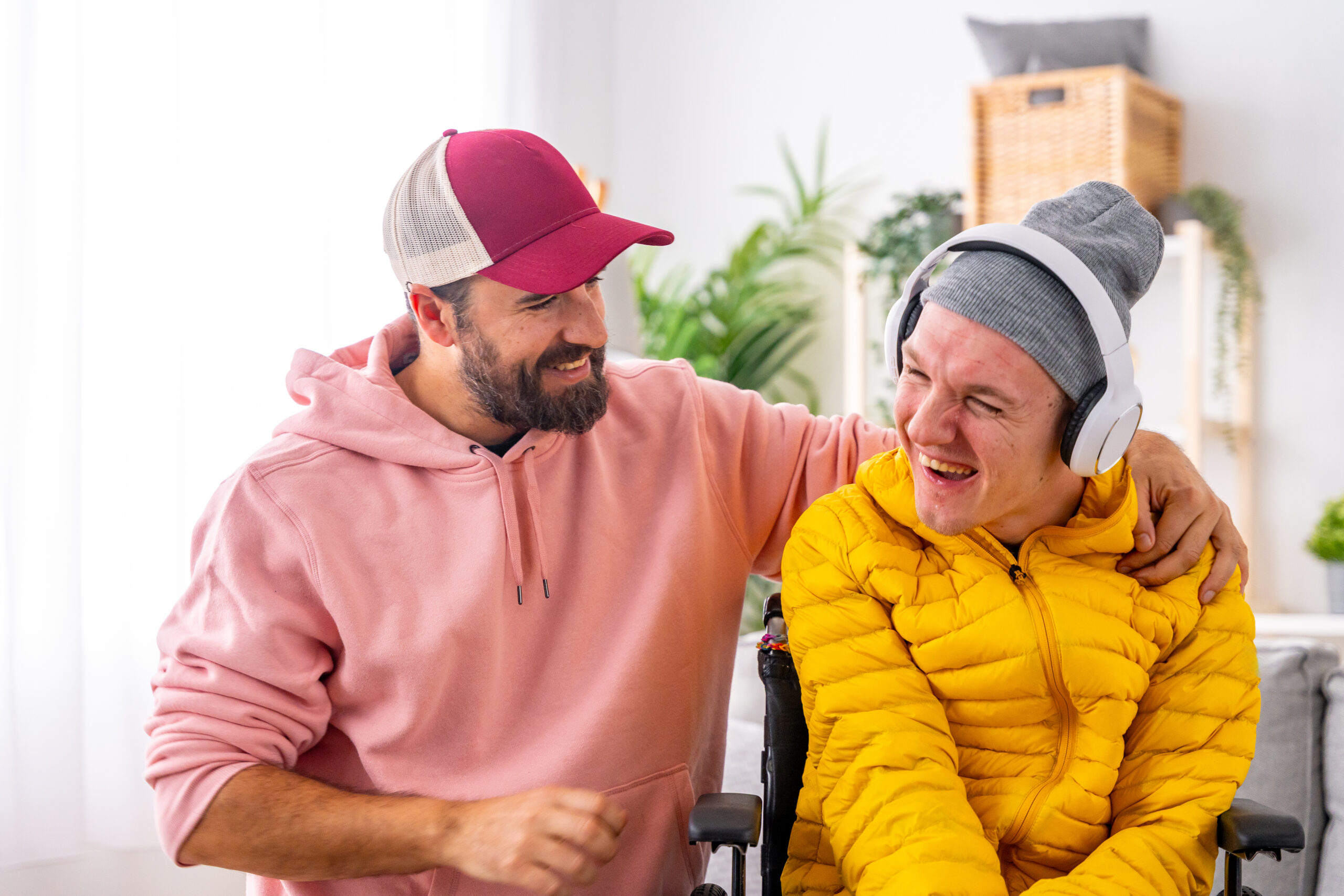 Caregiver assisting individual during art therapy session